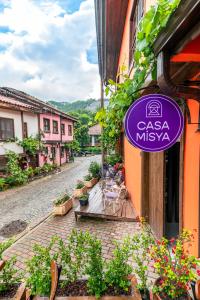 a purple sign on the side of a building at CASA MİSYA in Bursa