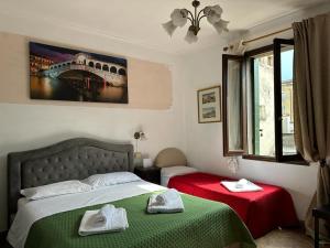 Postel nebo postele na pokoji v ubytování Venice Guest House