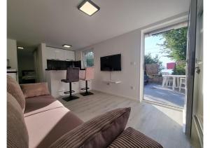 Et tv og/eller underholdning på Apartman Luna - 50 m od mora