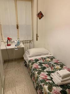 Posteľ alebo postele v izbe v ubytovaní 4 Season B&B Roma