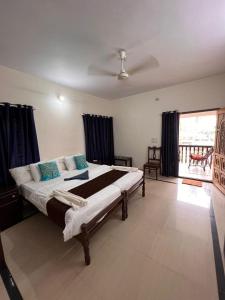 A bed or beds in a room at SAND BEACH HOUSE VARKALA
