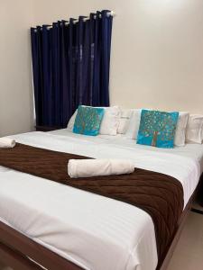 A bed or beds in a room at SAND BEACH HOUSE VARKALA