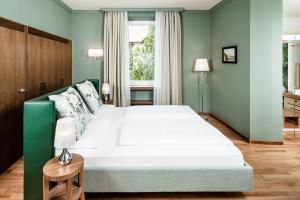 Postel nebo postele na pokoji v ubytování Villa Bavaria