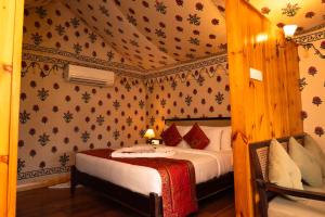 a bedroom with a bed in a room at Om Vilas Benares, Varanasi in Varanasi
