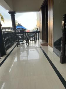 A balcony or terrace at SAND BEACH HOUSE VARKALA