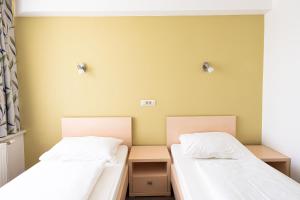 Postel nebo postele na pokoji v ubytování Grajski Dvor