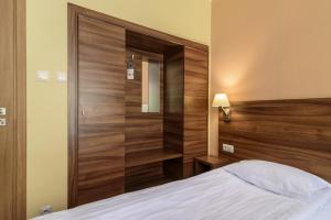 Postel nebo postele na pokoji v ubytování Hotel Podium
