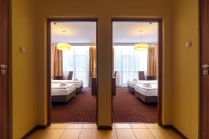 Postel nebo postele na pokoji v ubytování Hotel Podium