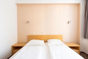 Postel nebo postele na pokoji v ubytování Grajski Dvor