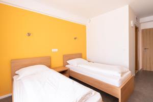 Postel nebo postele na pokoji v ubytování Grajski Dvor