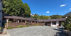 a house with a driveway in front of it at Caolingdai BnB in Gukeng