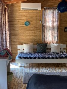 a bedroom with two beds in a room at Bamboo Bungalow with Sea View in Kabak Bay, Ölüdeniz in Fethiye