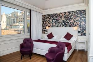 Postel nebo postele na pokoji v ubytování Grand Hotel Palace