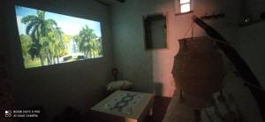 a room with a television and a table and a window at 'La Casa de LoLa' casita de cuento con vistas in Arenas de San Pedro