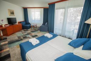 Postel nebo postele na pokoji v ubytování Hotel Toplice - Terme Čatež + 37 fotografií