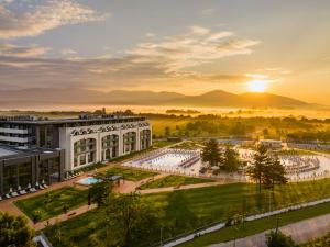an aerial view of the campus at sunset at Kings' Valley Medical & Spa Hotel in Kazanlŭk