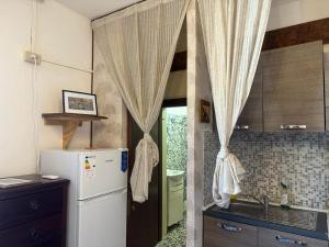 Kuchyň nebo kuchyňský kout v ubytování Venice Guest House