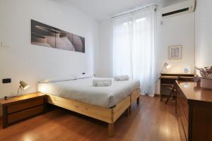Säng eller sängar i ett rum på PrimoPiano - Pellegrino Rossi B