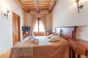 Postel nebo postele na pokoji v ubytování Hotel Rincón Castellano