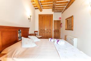 Postel nebo postele na pokoji v ubytování Hotel Rincón Castellano