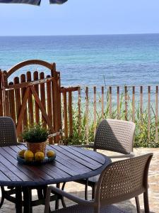 a table with fruit on top of it on the beach at Residenza Fontanelle-Beach Resort in Santa Maria di Castellabate