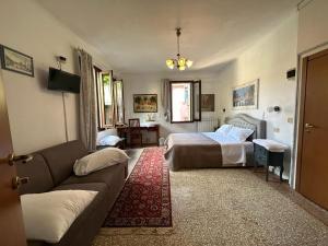 Postel nebo postele na pokoji v ubytování Venice Guest House
