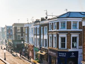 a group of buildings on a city street at Stylish Notting Hill Photographers Apartment in London