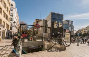 a group of people walking on a city street at Bohemian 2bedroom attic in Lavapies in Madrid