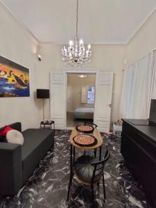 a living room with a couch and a table at Cave Bianche Apartments in Favignana