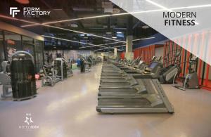 a row of treadmills in a gym at Iris Hotel Eden - Czech Leading Hotels in Prague