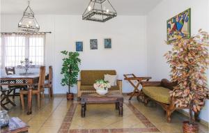 a living room with a couch and a table at Villas Del Mar in Puerto Calero