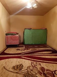 three suitcases sitting on the floor of a room at Mountain house in Xınalıq