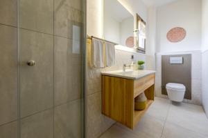 a bathroom with a sink and a toilet at Aral Tatil Ciftligi in Bozcaada