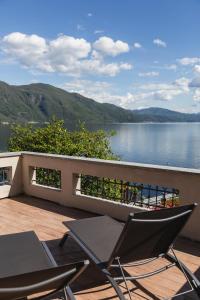 a balcony with a view of a body of water at Ca Meison in Cannobio