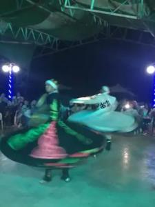 un grupo de personas bailando en un escenario en Villa HALA Sea View - Stella Di Mare - Families, en Zafarana