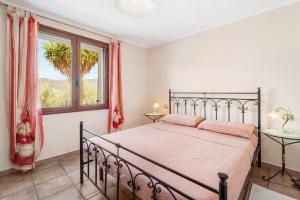 Postel nebo postele na pokoji v ubytování Casa Oleandro