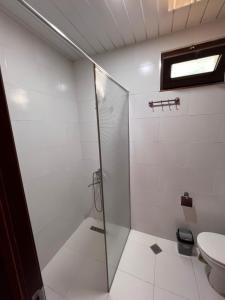 a bathroom with a shower and a toilet at Senima's paradise in Batumi
