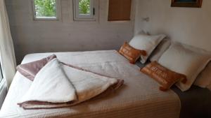 Säng eller sängar i ett rum på La Maison De Valerie