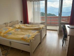 Rooms Haltenegg客房内的一张或多张床位