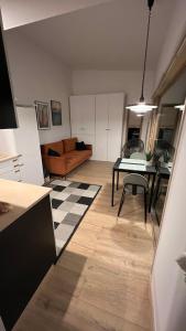 a living room with a couch and a table at Gniazdo 35 in Okuninka +15 photos