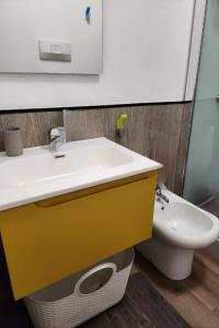 a bathroom with a sink and a toilet at Casa Baveno in Baveno