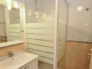 a bathroom with a shower and a sink at VVF Résidence Saint-Cyr-sur-Mer in Saint-Cyr-sur-Mer