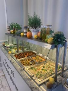 a display case with many different types of food at Dworek Bursztynowy in Karwia