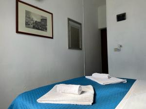 Postel nebo postele na pokoji v ubytování Venice Guest House
