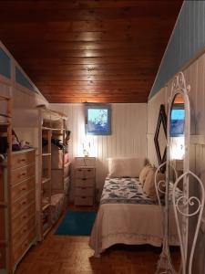 a bedroom with a bed and bunk beds in it at Tom e Jerry in Domus de Maria