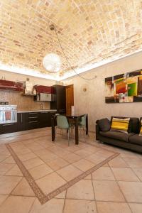 a living room with a table and a couch at IamartinoApartments in Termoli +11 photos