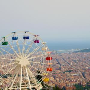a ferris wheel in front of a city at TOC Hotel Las Ramblas in Barcelona