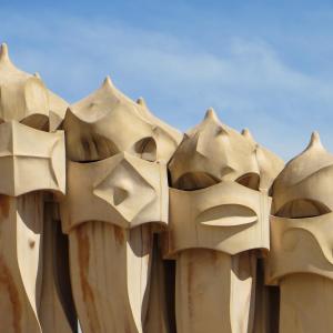 a group of wooden masks on the side of a building at TOC Hotel Las Ramblas in Barcelona