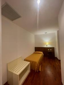 Postel nebo postele na pokoji v ubytování Hotel La Lampara