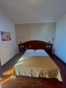 Postel nebo postele na pokoji v ubytování Hotel La Lampara